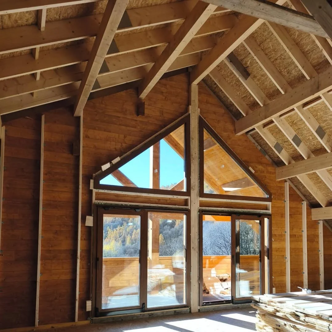 Visible solid timber structure inside the completed Alpine Log House