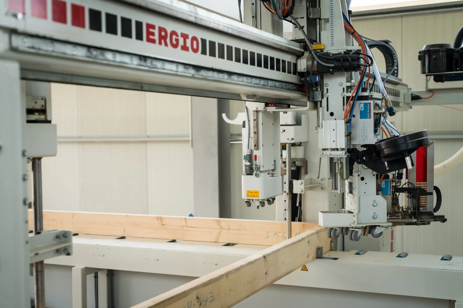 Automated timber panel production machine operating inside the ERGIO factory