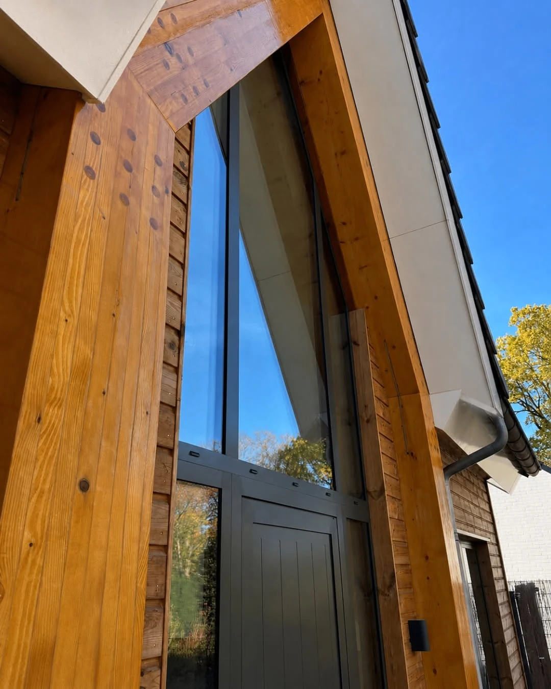 Dutch Rapid-Assembly Timber Residence tall glazed entrance detail