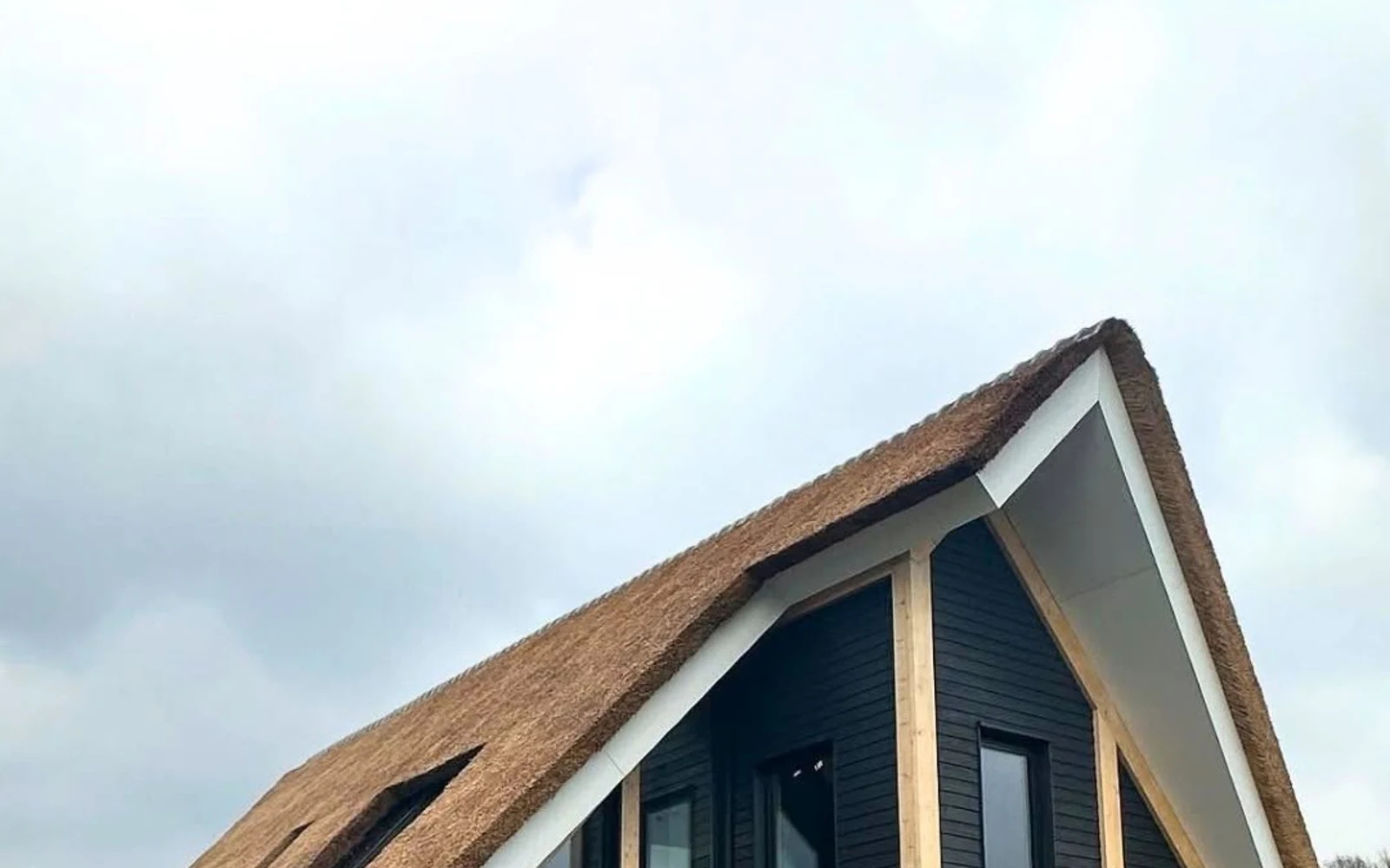 Wide view of the Dutch thatched timber residence