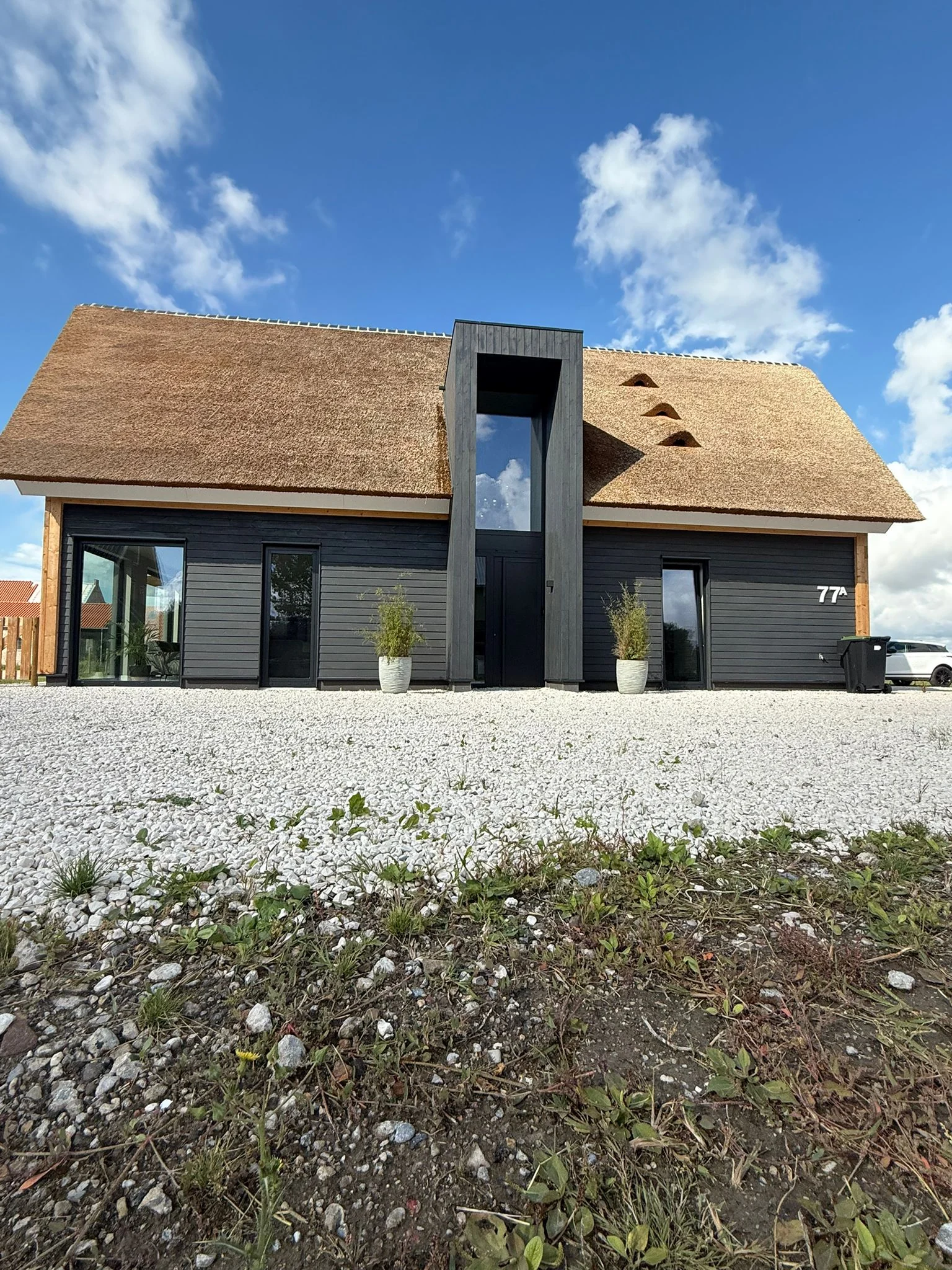 Ed timber residence front elevation with central entrance volume