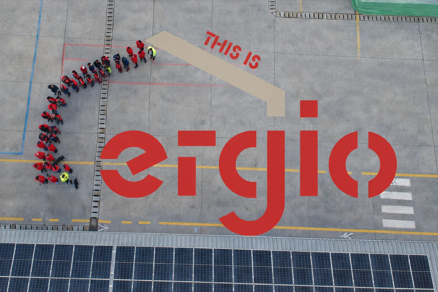 ERGIO team forming the company logo at the production site