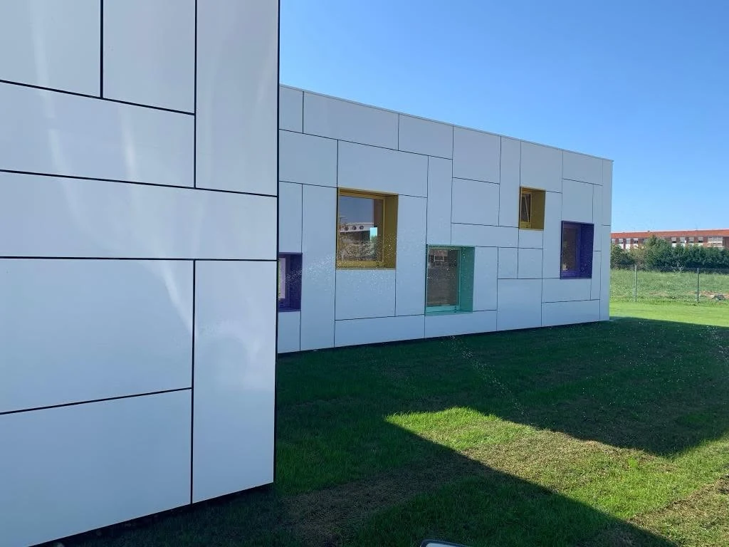 Corner façade detail with coloured kindergarten windows