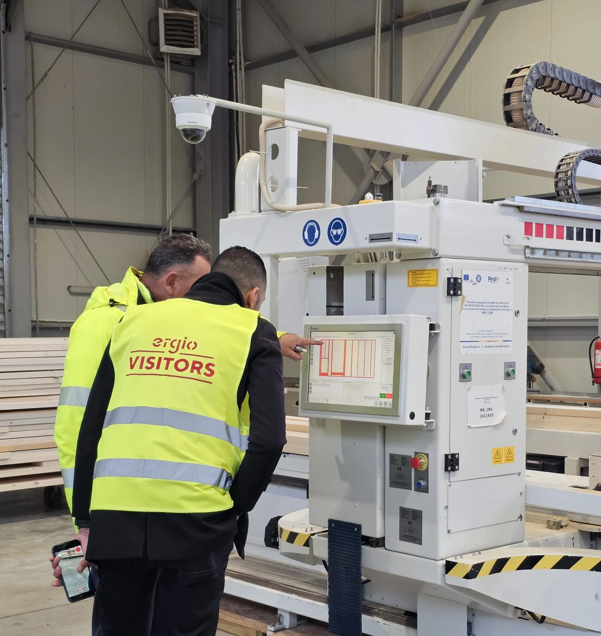 Factory visit beside a timber production machine