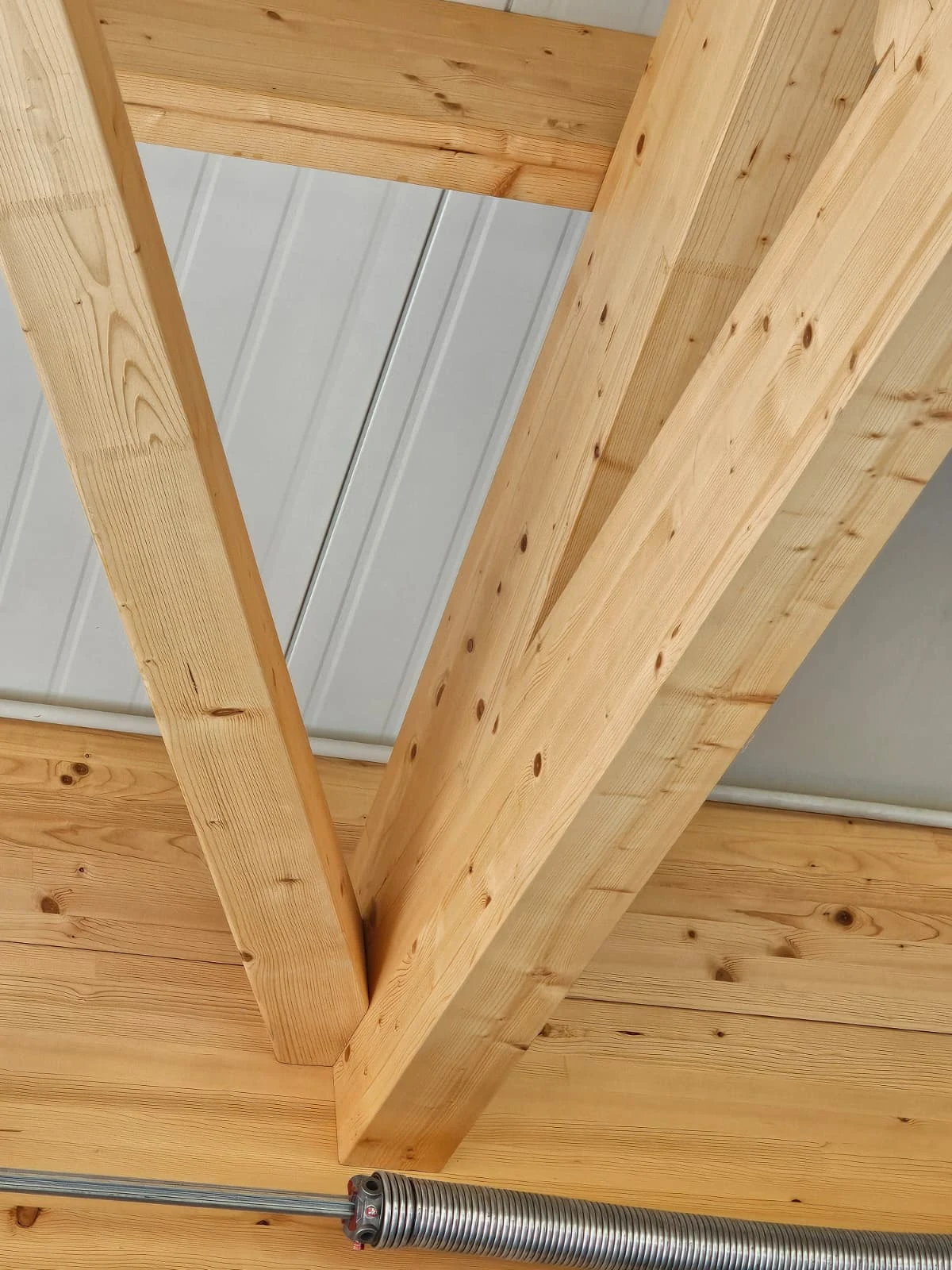 Close-up of a machined timber beam and brace connection