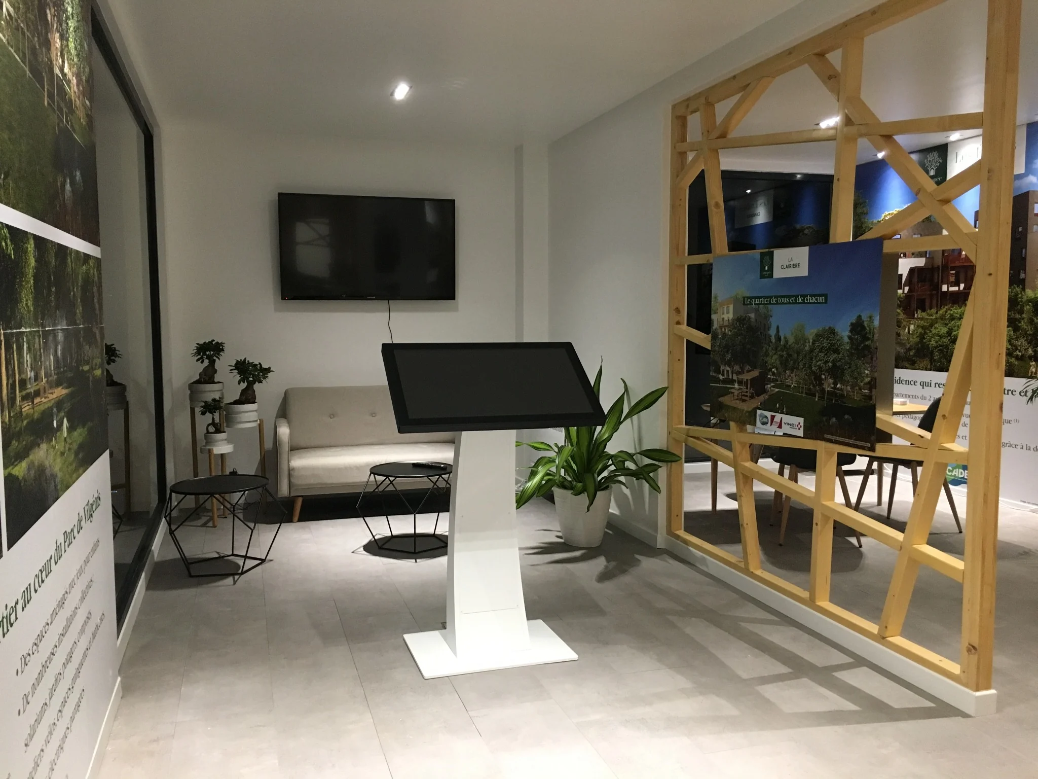 Interior consultation area with digital display in the Massy timber building