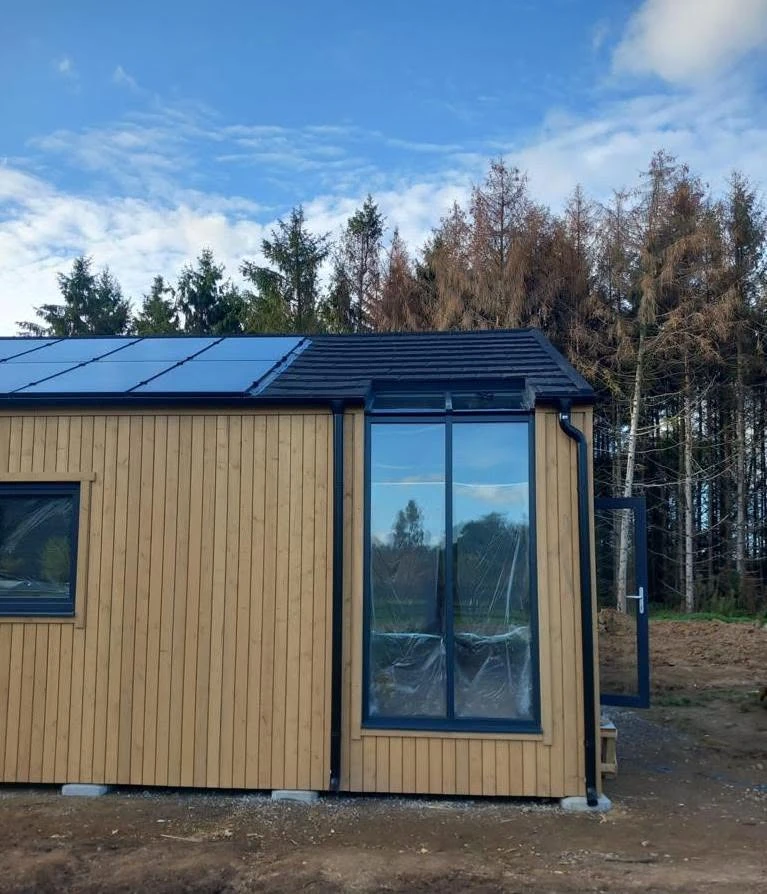 Tall glazed corner detail of the Megane Fletcher project