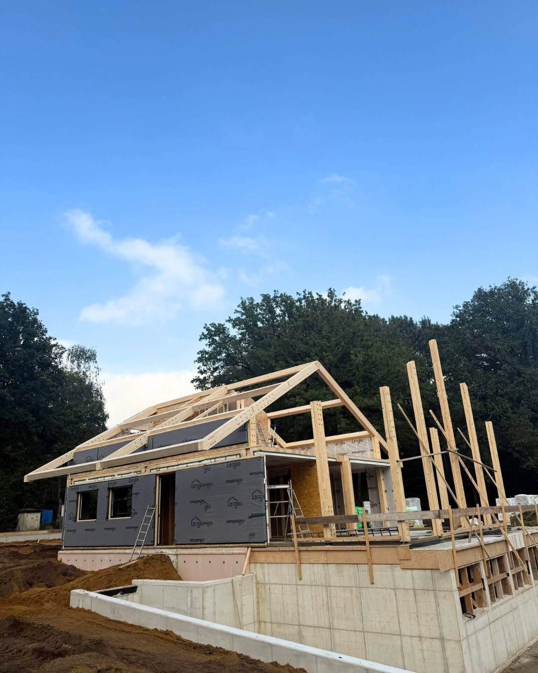 Post and beam frame rising over the Vasse project basement
