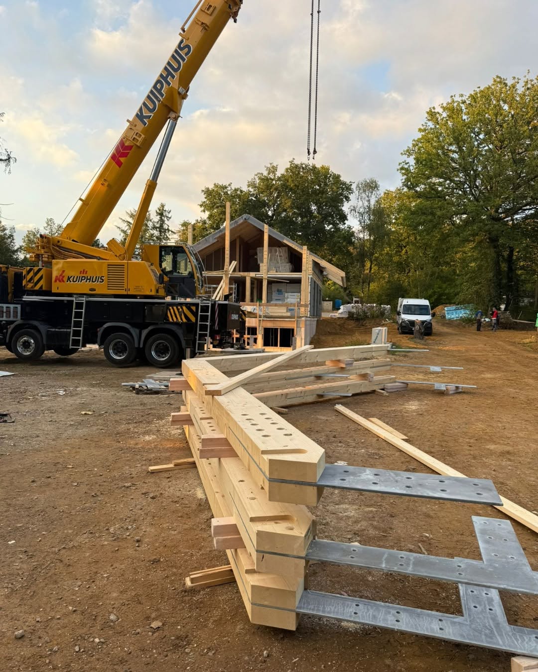 Crane operation and timber beams prepared for the Vasse project