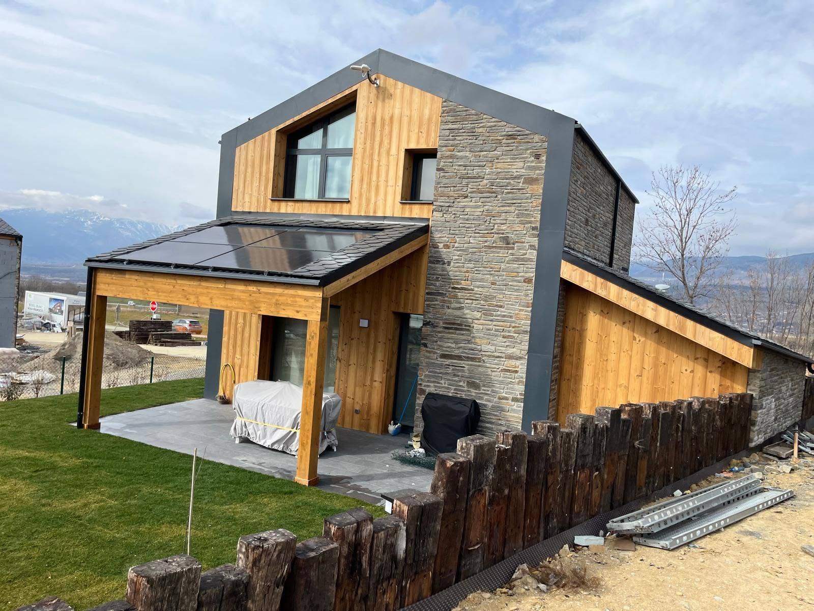 Hybrid stone and timber residence viewed from the garden