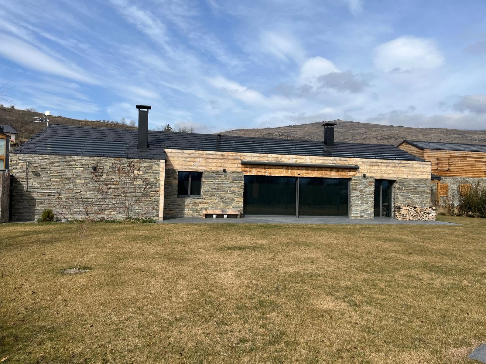 Long garden elevation of the stone residence