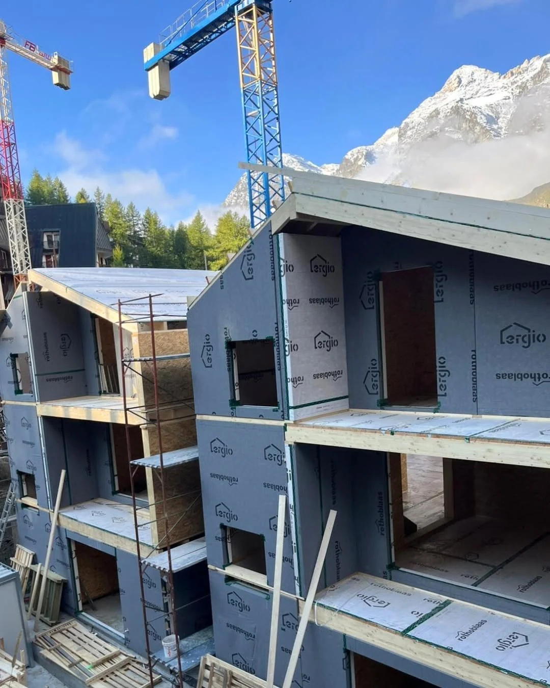 Multiple prefabricated hotel units during coordinated envelope installation